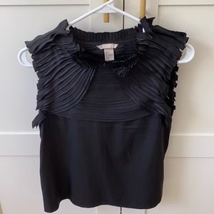 H&M black sleeveless top. Never worn. Size 4